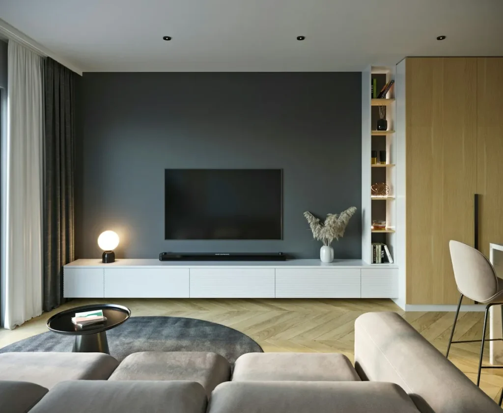 Modern living room with a sofa and a wall-mounted TV